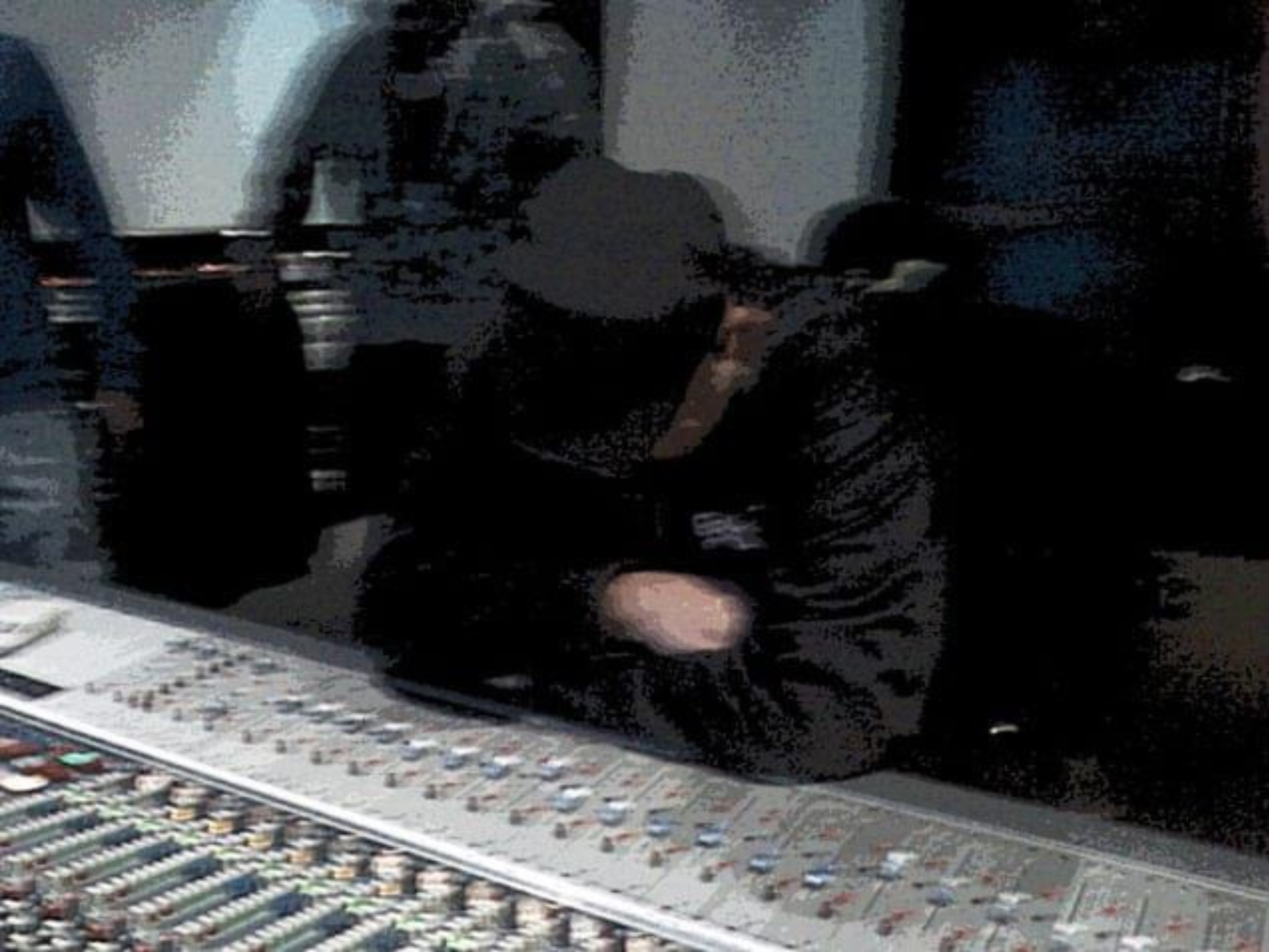 Joel Numa at a studio mixing console